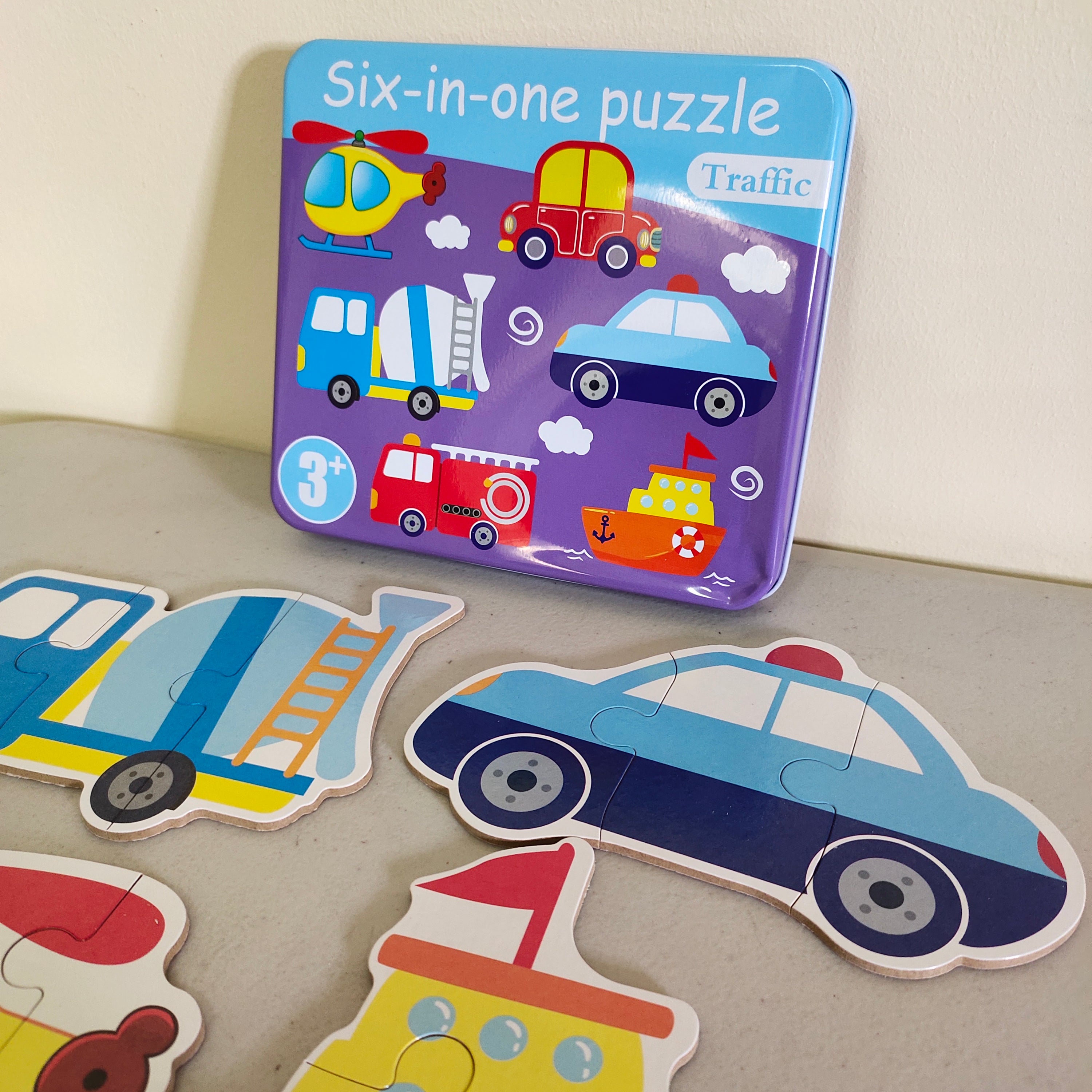 Fidtoy Casse-tête 6-en-1 avec numéros et boîte de rangement en métal sur le thème des transports pour enfants, ensemble de puzzles de reconnaissance des numéros sur le thème des transports, puzzle d'apprentissage évolutif pour les tout-petits de 2 à 6 ans