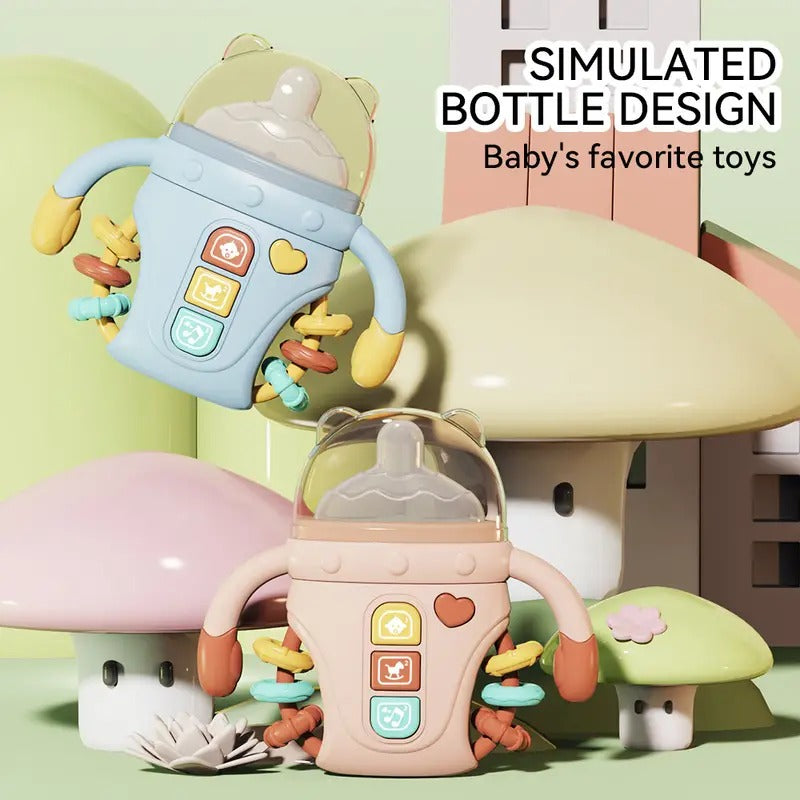 Fidtoy Biberon sensoriel bébé réconfortant avec lumières, musique et anneau de dentition | Jouet d'apprentissage apaisant pour bébés de 6 à 24 mois