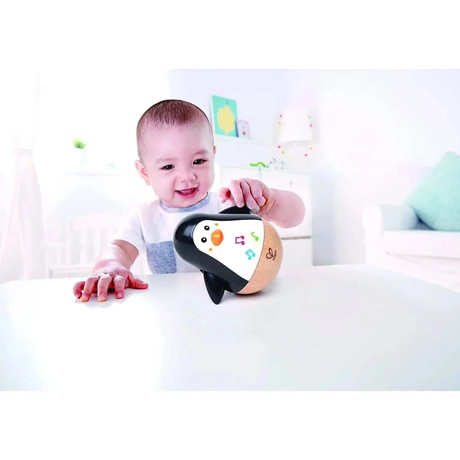 Fidtoy Jouet musical en bois culbuto Pingouin pour bébés 6M+