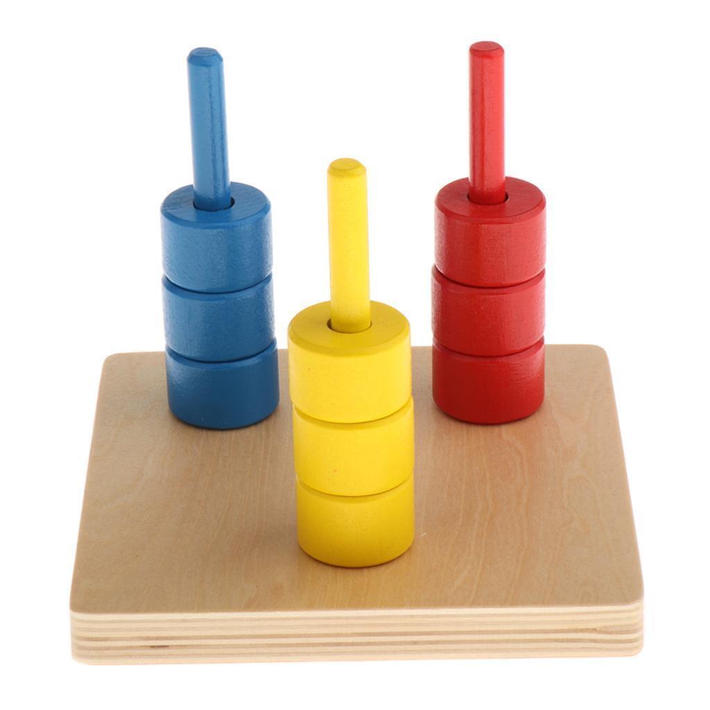 Discos de colores Montessori en tres espigas verticales